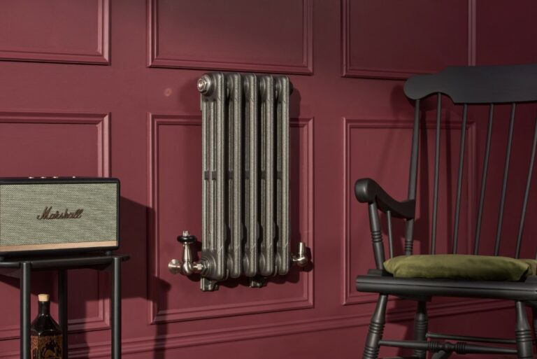Wall mounted cast iron radiator with adjustable brackets